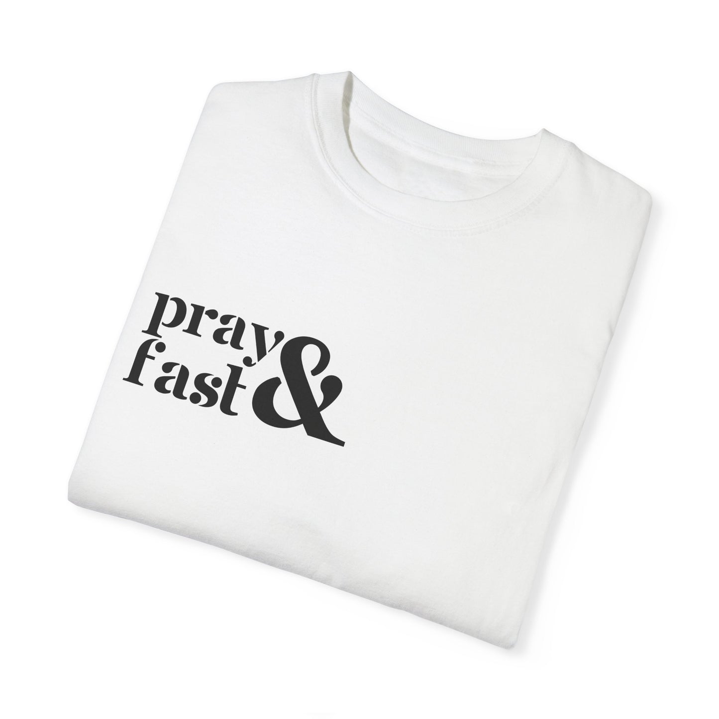 Folded white relaxed t-shirt with "pray" written in black on top and "fast" written below in black with black ampersand next to both in top right chest area.