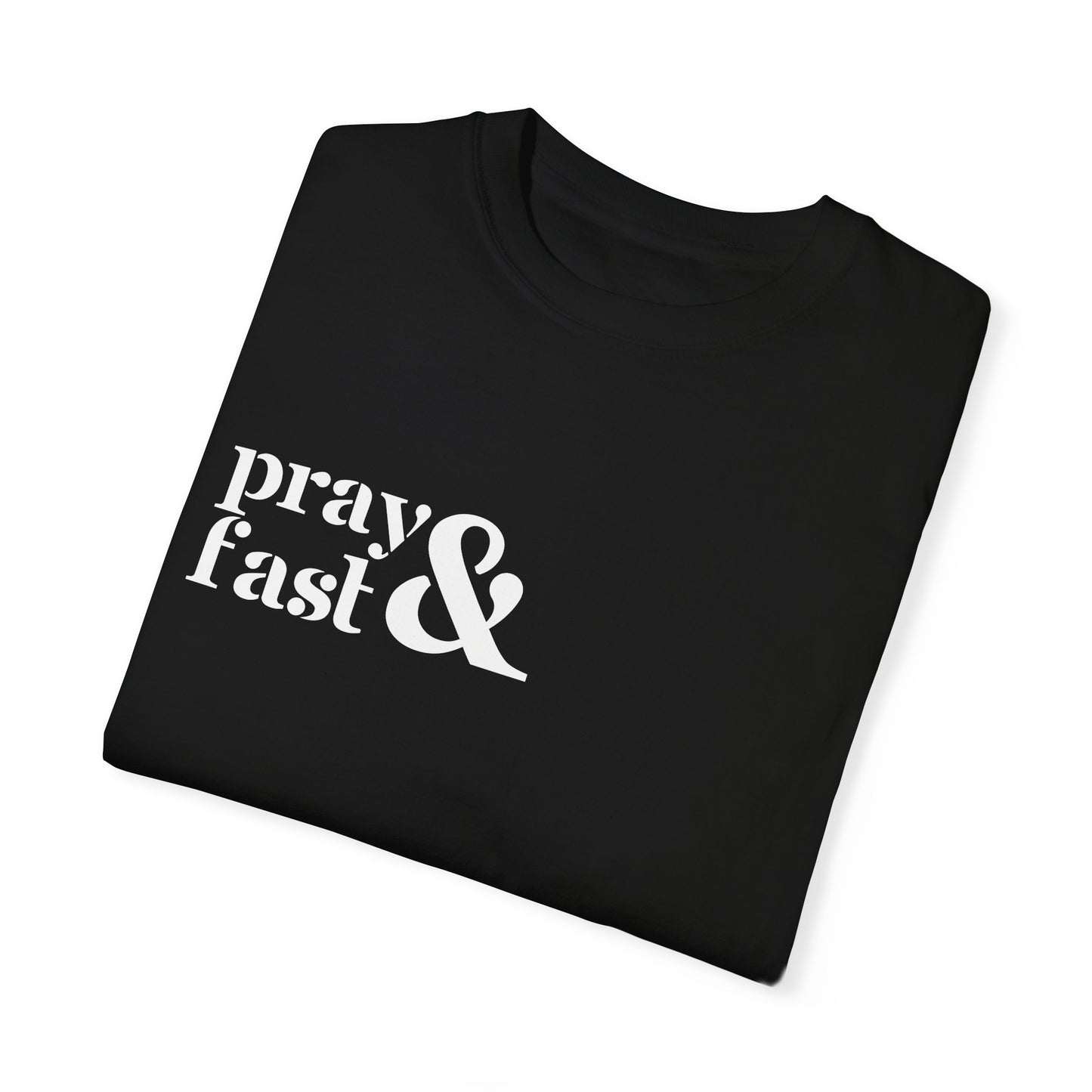 Folded black relaxed t-shirt with "pray" written in white on top and "fast" written below in white with white ampersand next to both in top right chest area.